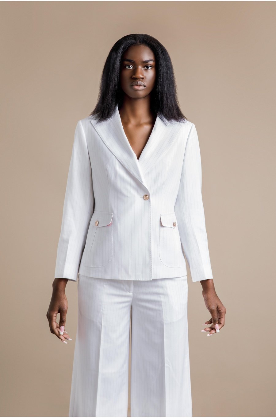 Elolo white gold pinstripe double-breasted suit. Crafted in soft poly wool and decorated with crown gold buttons
