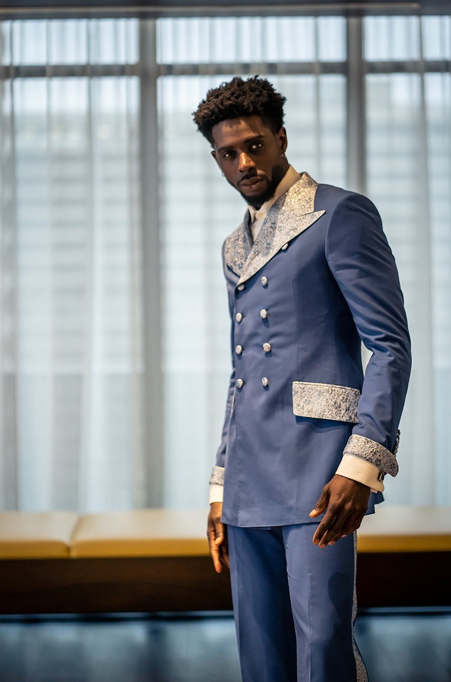 Nalikem azure double-breasted poly-wool suit with textured fabric on lapel. Decorated with custom textured buttons and pockets.