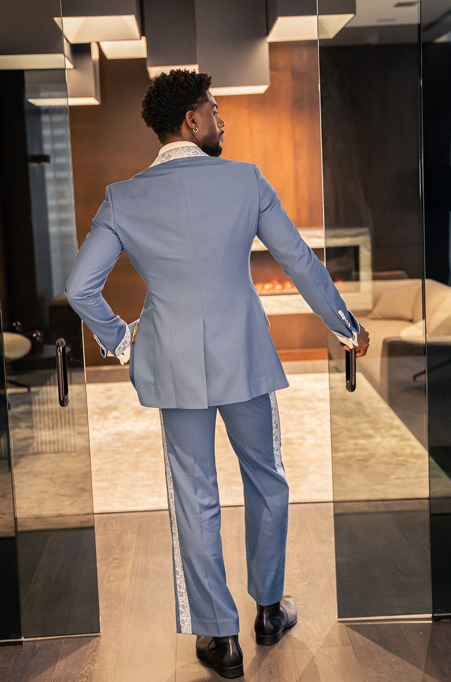 Nalikem azure double-breasted poly-wool suit with textured fabric on lapel. Decorated with custom textured buttons and pockets.
